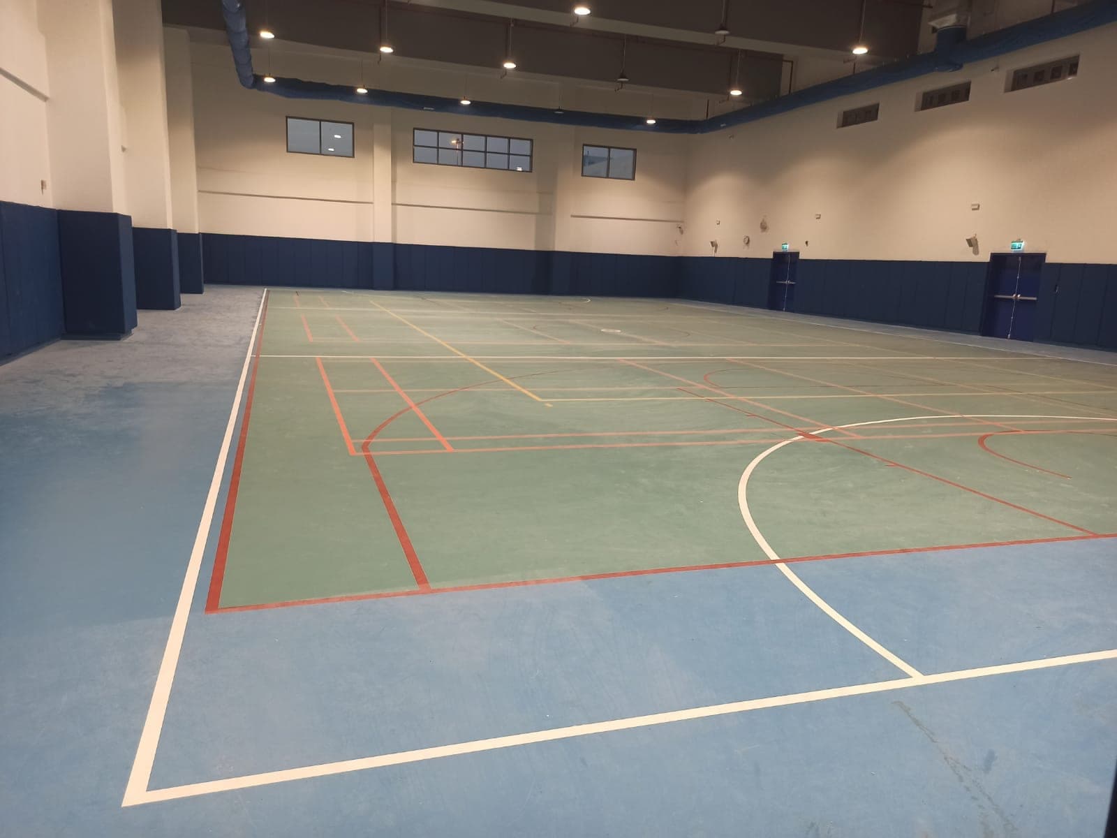 Doha British School, Al Wakra — EN 14904 safety wall panels installed by Ayana, Qatar 2024.